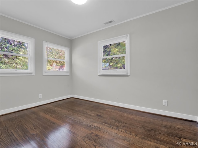 unfurnished room featuring ornamental molding and dark hardwood / wood-style floors