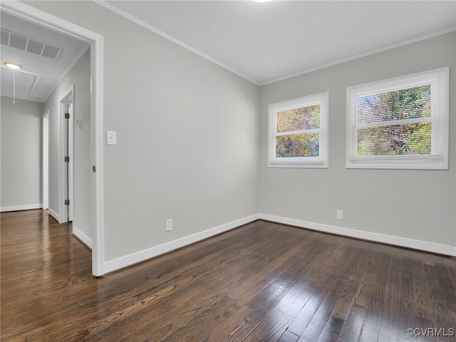 empty room with crown molding and dark hardwood / wood-style floors