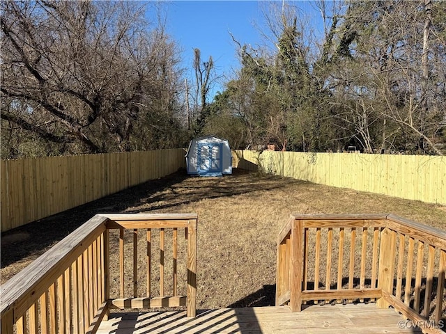 view of yard with a deck and a shed