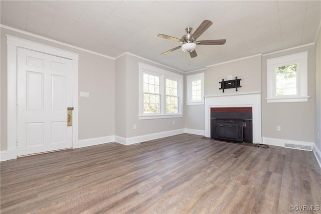 unfurnished living room featuring hardwood / wood-style floors, ceiling fan, and ornamental molding