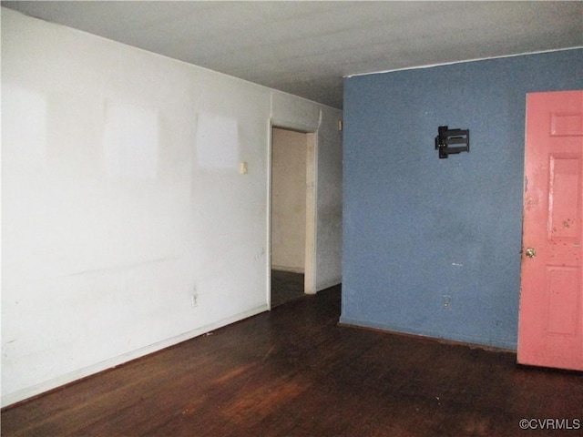 spare room featuring dark hardwood / wood-style floors