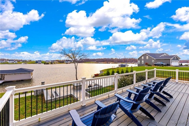 wooden deck featuring a water view