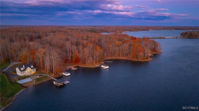 aerial view at dusk with a water view