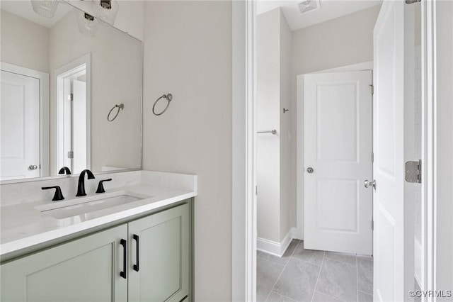 15812 W Millington Dr, Midlothian, VA 23112 - bathroom featuring vanity, baseboards, and marble look tiles