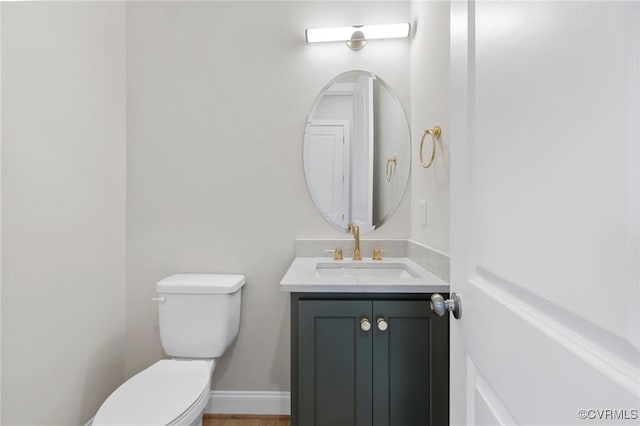 15812 W Millington Dr, Midlothian, VA 23112 - half bath featuring toilet, vanity, wood finished floors, and baseboards