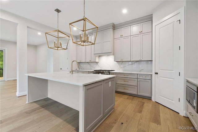15812 W Millington Dr, Midlothian, VA 23112 - kitchen featuring gray cabinets, light wood-type flooring, a chandelier, decorative backsplash, and recessed lighting