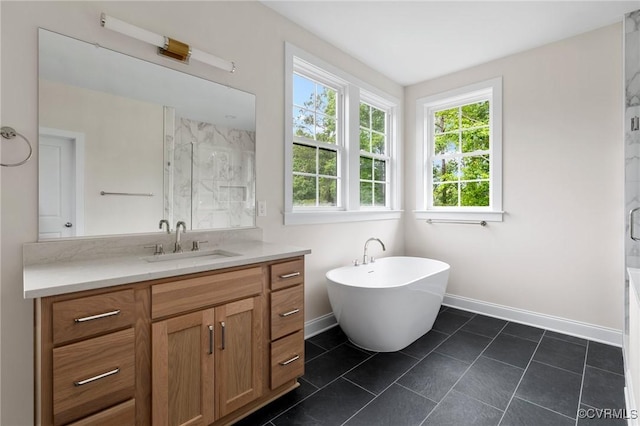 15812 W Millington Dr, Midlothian, VA 23112 - bathroom featuring vanity, a marble finish shower, a freestanding tub, and baseboards