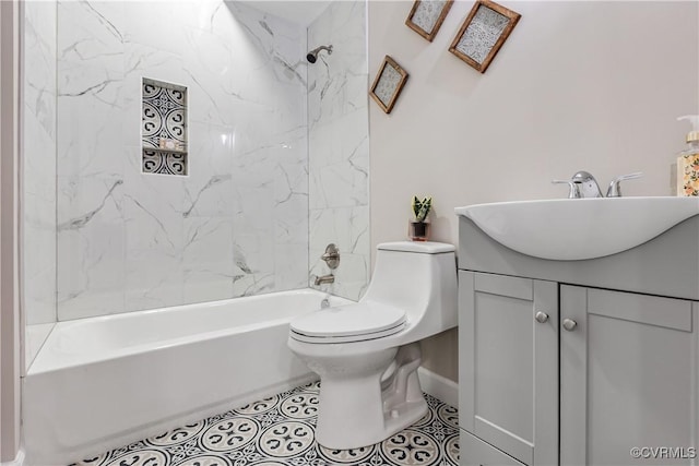 full bathroom featuring tile patterned flooring, vanity, toilet, and tiled shower / bath