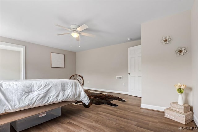 bedroom featuring dark hardwood / wood-style floors and ceiling fan