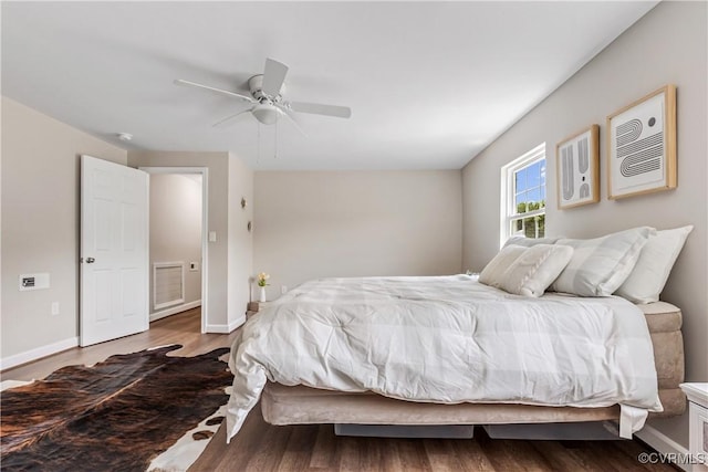 bedroom featuring ceiling fan and wood-type flooring