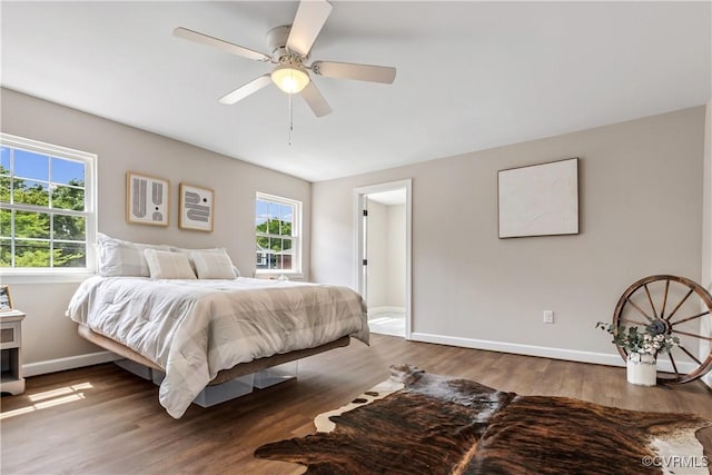 bedroom with hardwood / wood-style floors and ceiling fan