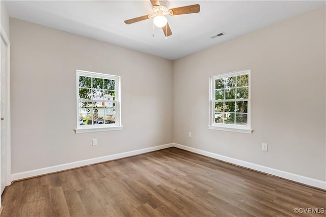 empty room with ceiling fan and wood-type flooring