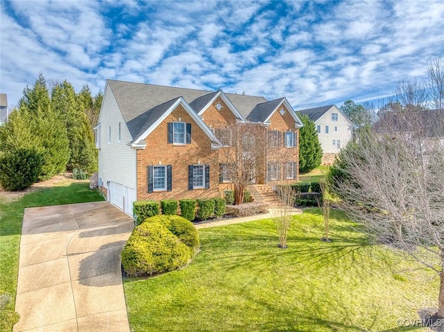 view of front of house with a front lawn and a garage