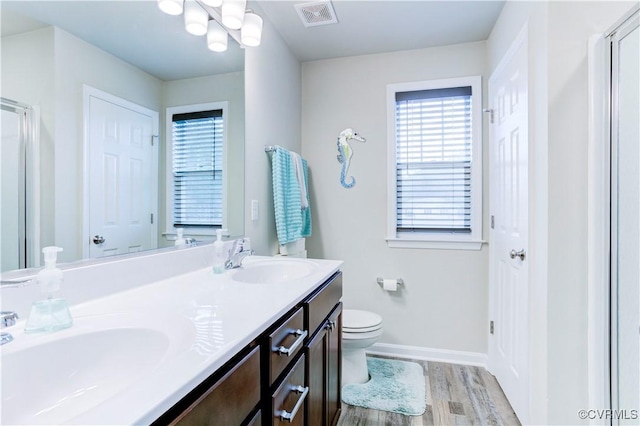 bathroom featuring hardwood / wood-style floors, vanity, and toilet