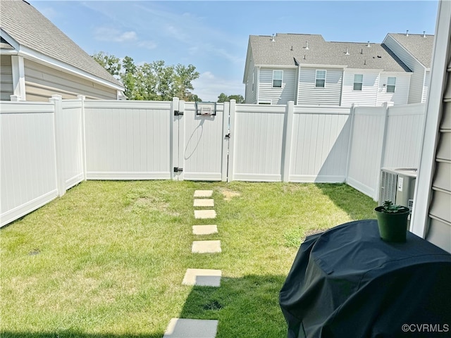 view of yard featuring central AC unit