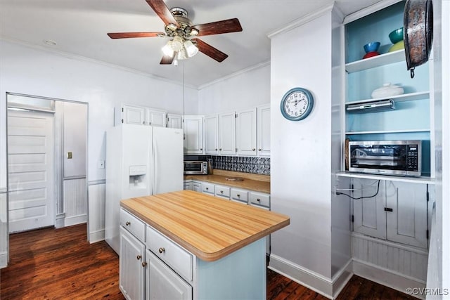 kitchen with white cabinets, dark hardwood / wood-style floors, ceiling fan, white fridge with ice dispenser, and a kitchen island