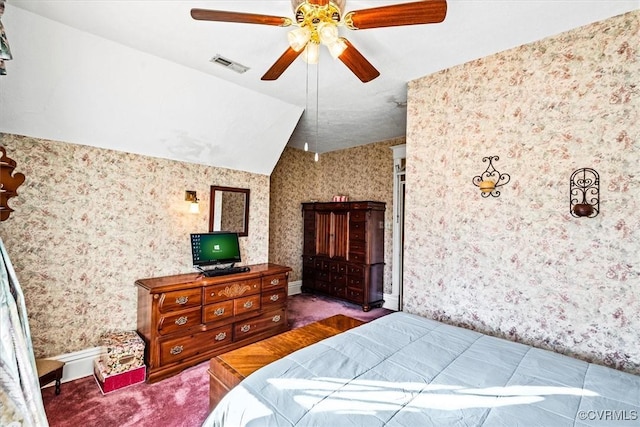 bedroom with dark carpet, ceiling fan, and lofted ceiling