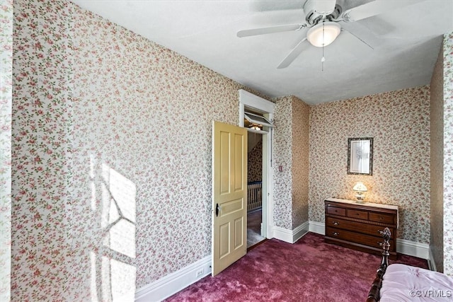 bedroom with ceiling fan and dark colored carpet