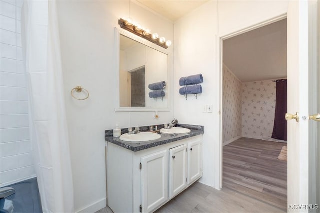 bathroom featuring vanity and wood-type flooring