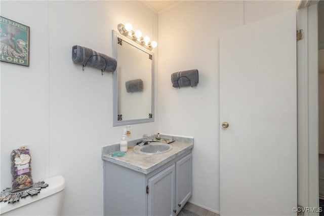 bathroom with vanity and toilet