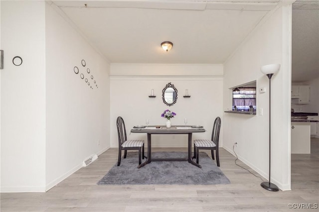 dining room featuring light wood-type flooring