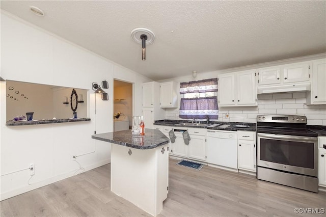 kitchen with a textured ceiling, electric stove, dishwasher, white cabinetry, and a breakfast bar area