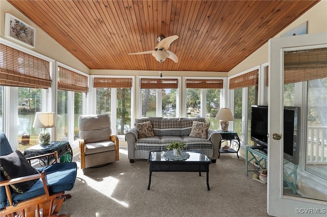 sunroom with ceiling fan, wood ceiling, and vaulted ceiling