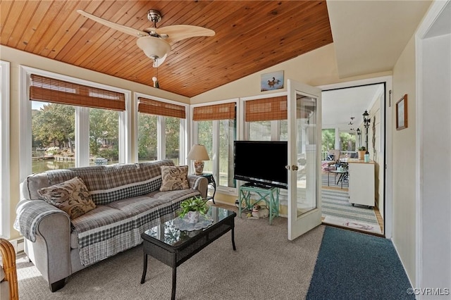 carpeted living room featuring ceiling fan, wooden ceiling, and vaulted ceiling