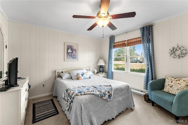 bedroom with ceiling fan, light carpet, a baseboard radiator, and ornamental molding