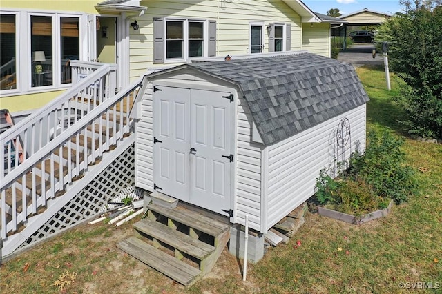 view of outbuilding featuring a yard