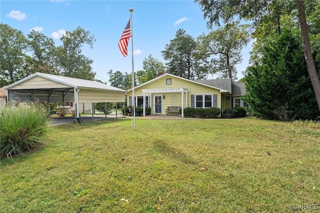 view of front of house with a carport and a front lawn