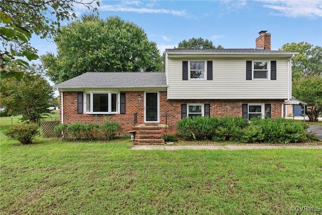 tri-level home featuring a front yard