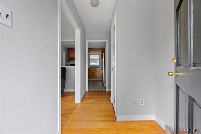 hall with light wood-type flooring