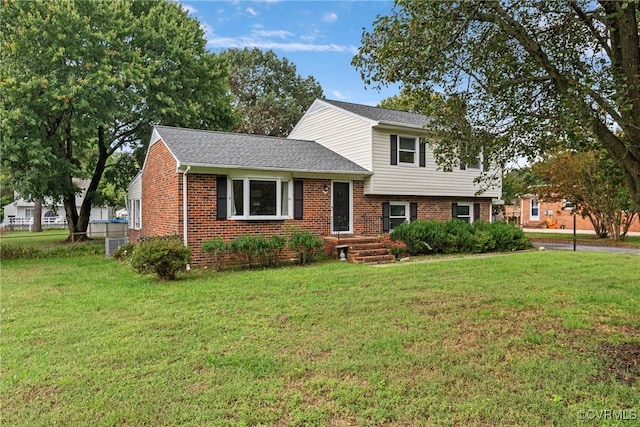 split level home featuring a front lawn