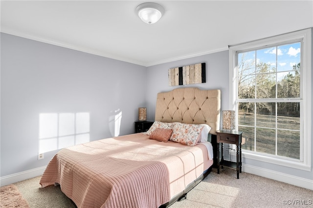 carpeted bedroom with ornamental molding and multiple windows