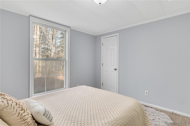 carpeted bedroom with ornamental molding