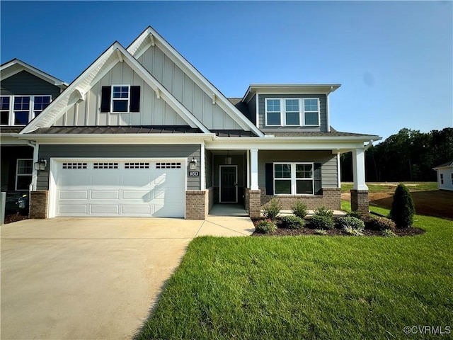 craftsman-style house featuring a garage and a front yard