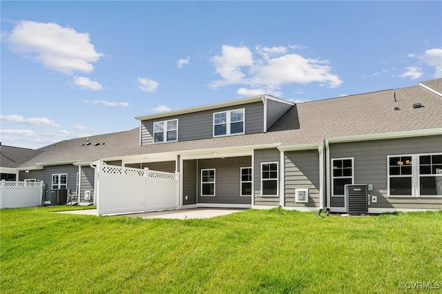 back of house featuring a yard, cooling unit, and a patio