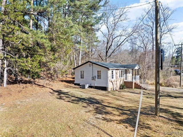 view of property exterior with central AC unit