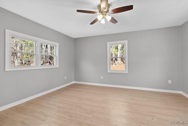 unfurnished room with ceiling fan and light wood-type flooring