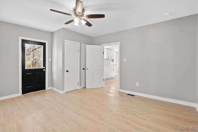 interior space featuring light wood-type flooring and ceiling fan