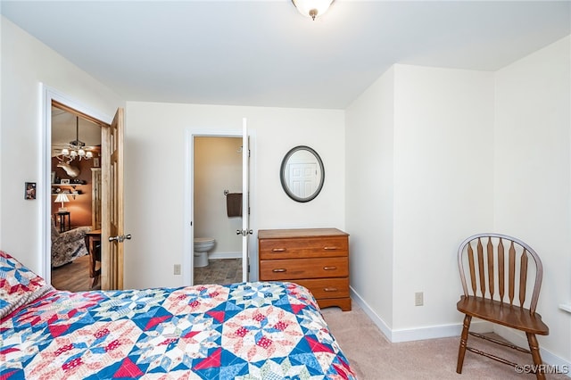 carpeted bedroom featuring ensuite bathroom