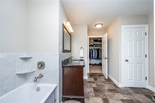 bathroom featuring vanity and a tub