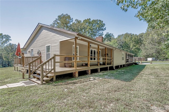 view of side of property with a lawn