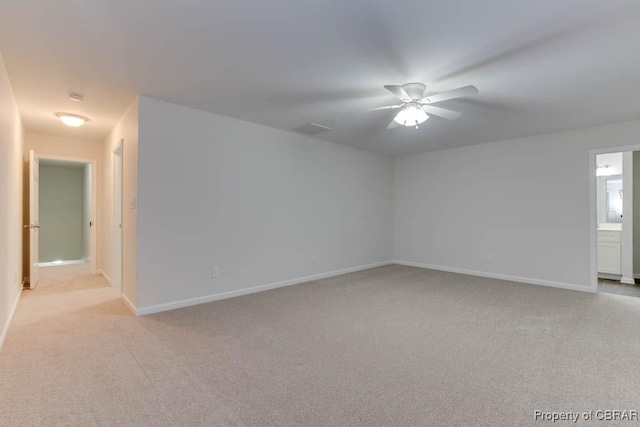 carpeted empty room with ceiling fan