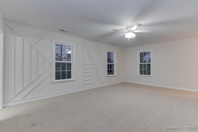 interior space featuring carpet flooring and ceiling fan