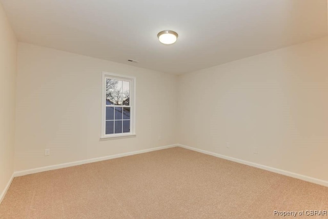 unfurnished room featuring carpet