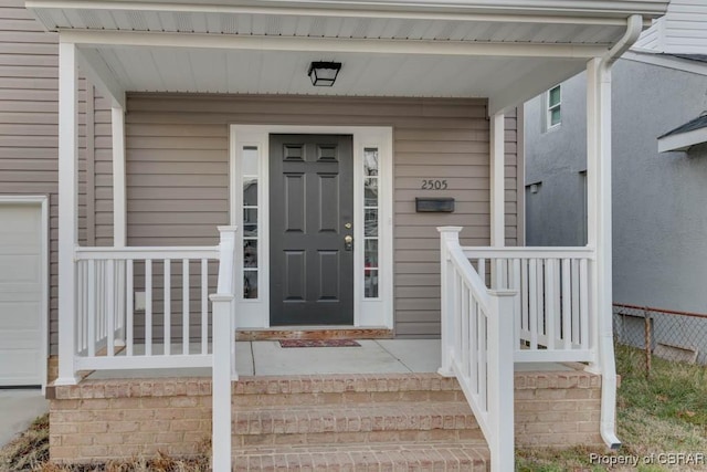 doorway to property with covered porch