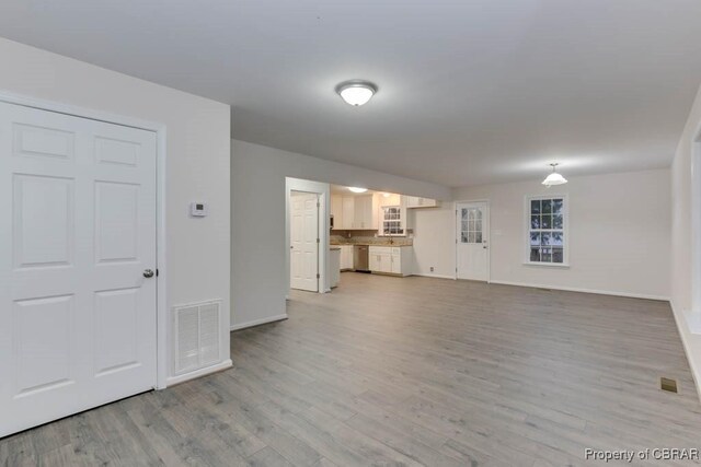 unfurnished living room featuring light hardwood / wood-style flooring