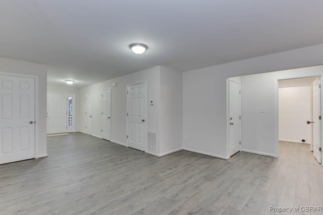 spare room featuring light hardwood / wood-style floors